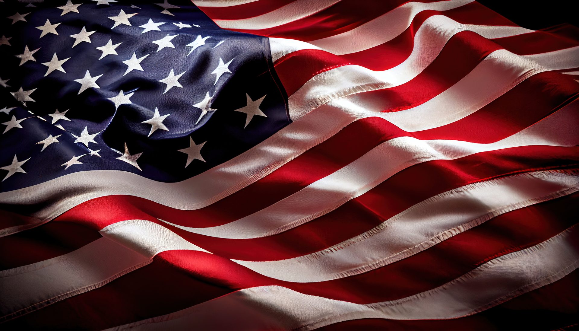 The American flag lit against a dark background, representing Orca IT Solutions building and staffing its managed IT and computer repair services entirely in the United States